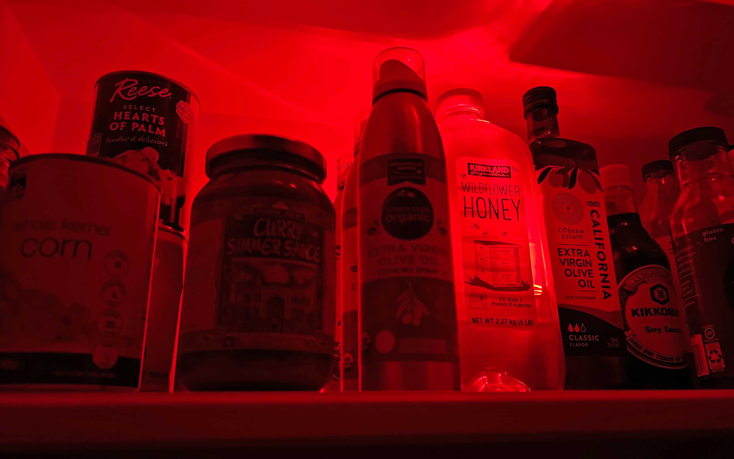 Food in pantry with red light