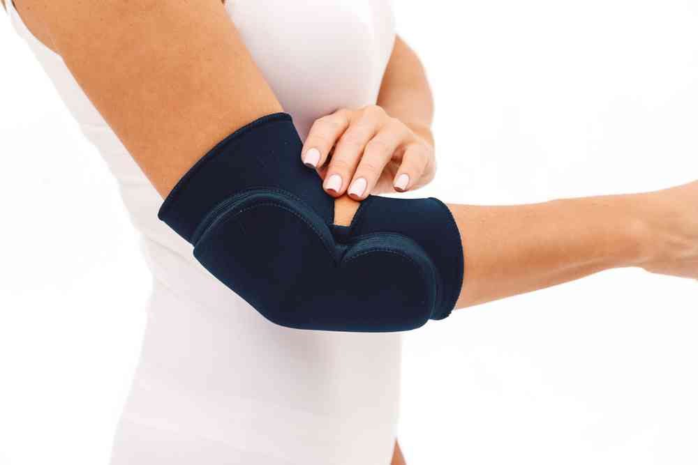Woman wearing an elbow brace