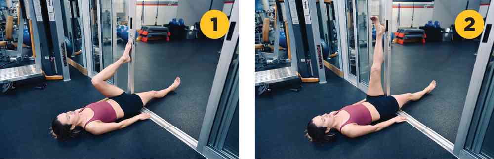 Woman demonstrating hamstring wall stretch exercise