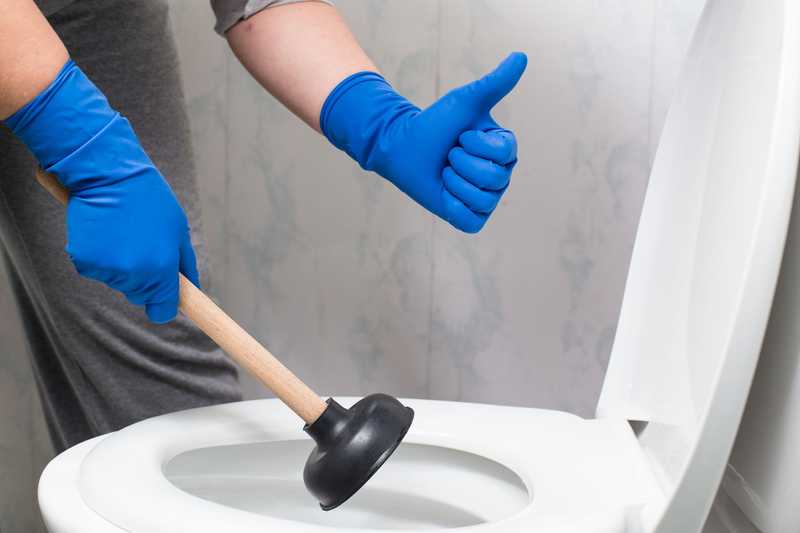Man plunging toilet