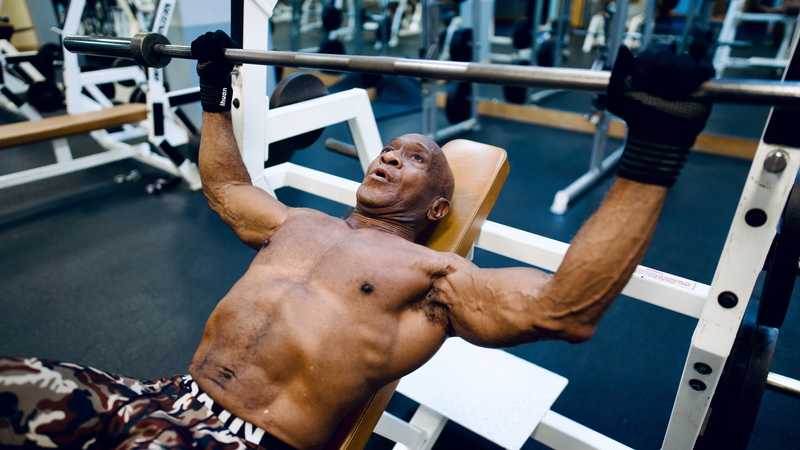 Man doing bench press exercise