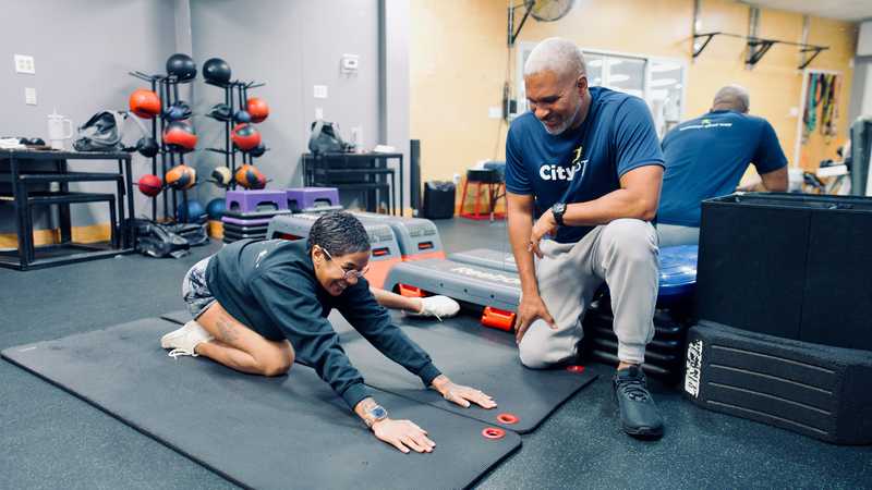 Physical therapist administering child's pose