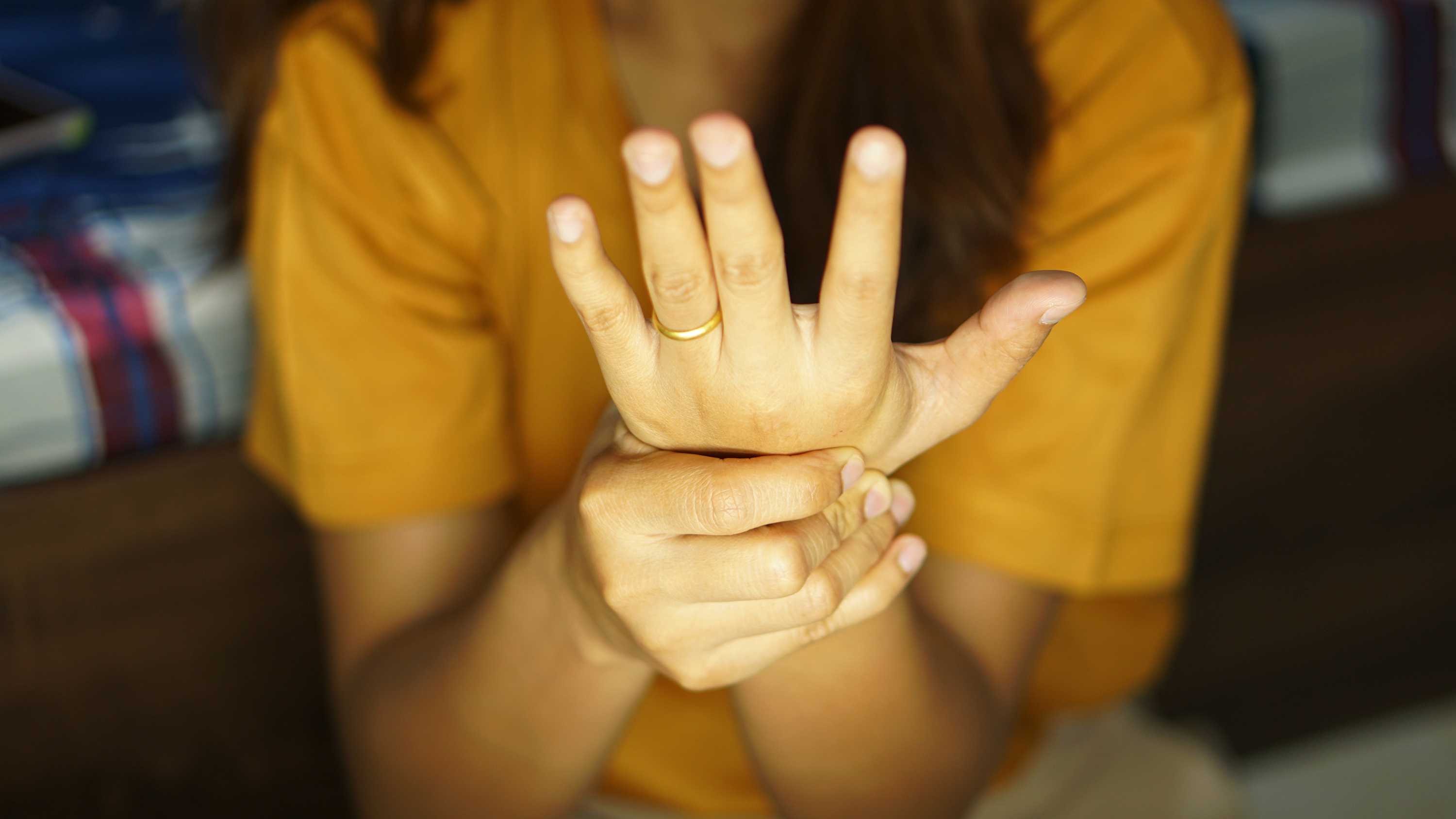 Woman massaging fingers