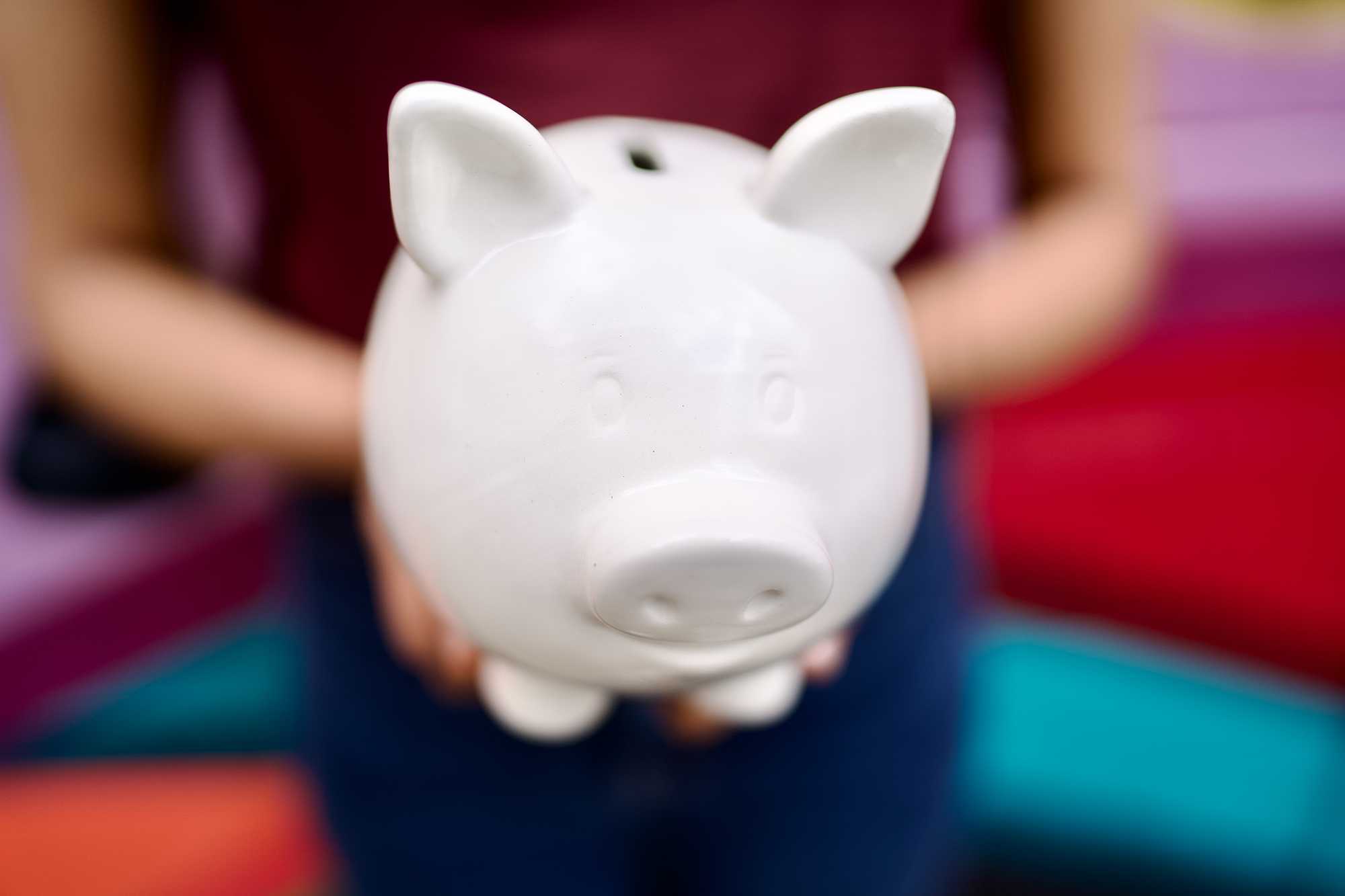 Woman holding a piggy bank