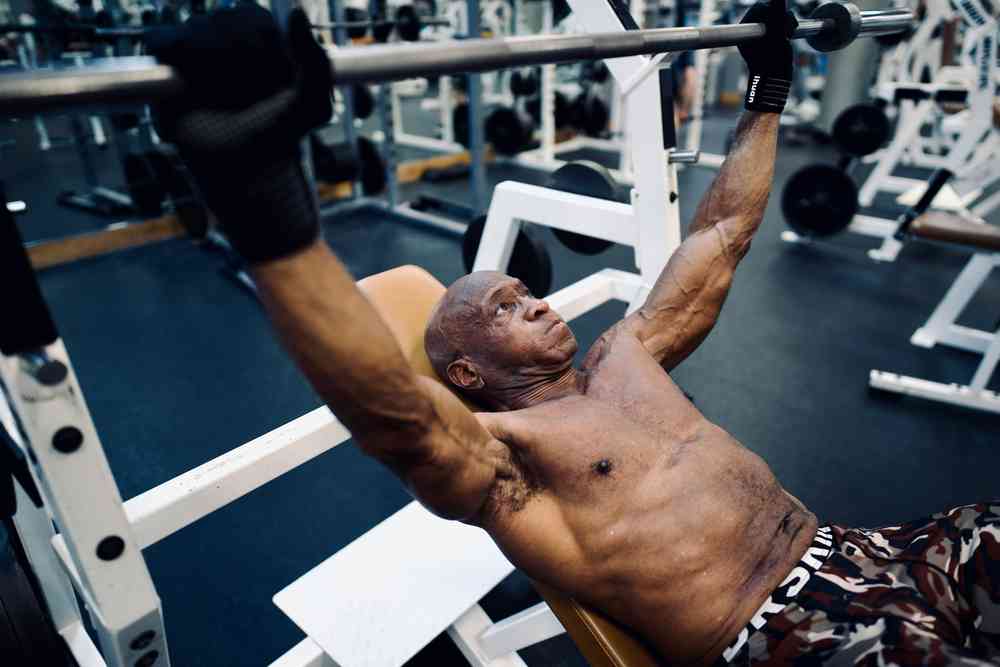 Man doing bench press with bar up