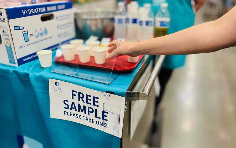 Woman sampling drink product